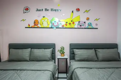 two beds sitting next to each other in a bedroom at Luxury Pokémon Haven with Private Playground Brinchang Cameron Highlands Clover Home 2-28 in Brinchang