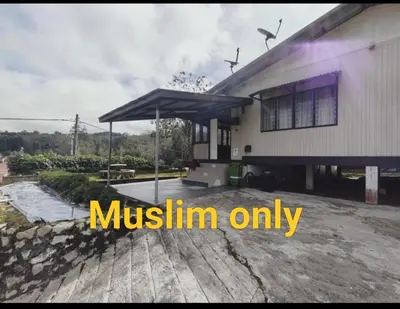 a house with amustlin only sign in front of it at Rizkie homestay in Tanah Rata