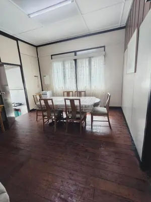 a dining room with a table and chairs at Rizkie homestay in Tanah Rata