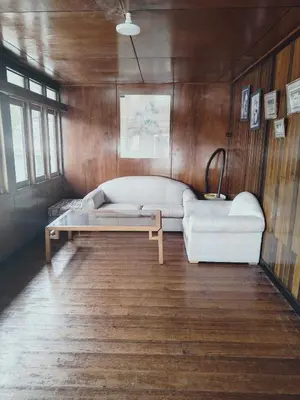 a living room with a couch and a coffee table at Rizkie homestay in Tanah Rata