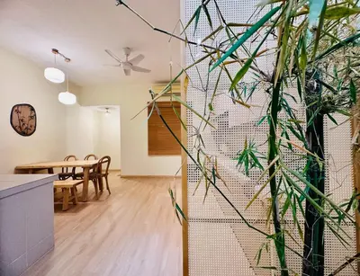 a kitchen and dining room with a wall of plants at New Takekaze Retreat \u7af9\u98ce\u4e4b\u5bb6 for 14 pax at Central Penang in George Town