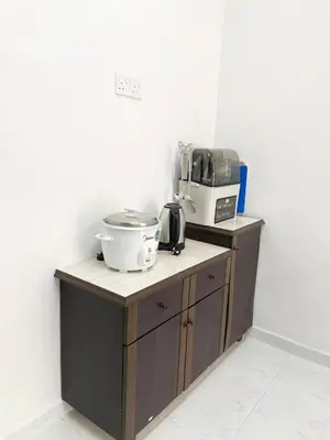 a kitchen with a counter with a appliance on it at ROOMSTAY KOME Merapoh in Perhentian Merapuh Baharu