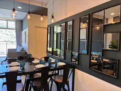 a dining room with a table and chairs at Cameron Golden Hills Near Night Market CH1 in Brinchang
