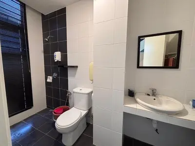 a bathroom with a toilet and a sink at Cameron Golden Hills Near Night Market CH1 in Brinchang