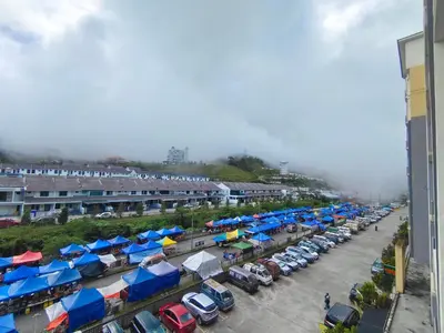 an aerial view of a parking lot with cars parked at Cameron Golden Hills Near Night Market CH1 in Brinchang