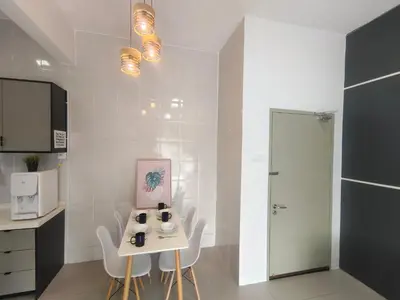 a kitchen with a small table and chairs in a room at Cameron Golden Hills Near Night Market CH1 in Brinchang
