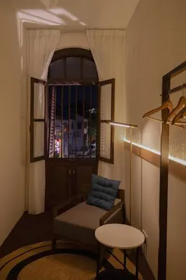 a living room with a couch and a window at Armenian House by IIP in George Town