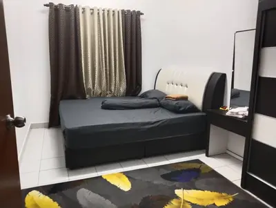 a small bedroom with a bed and a window at Nufa homestay-seri iskandar in Seri Iskandar