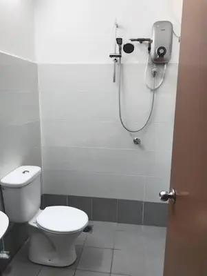 a bathroom with a toilet and a shower at Nufa homestay-seri iskandar in Seri Iskandar