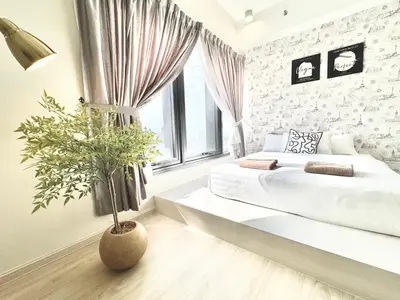 a white bedroom with a bed and a potted plant at Tropicana 218 Macalister #Georgetown #Infinity Pool #2pax studio suite #1 Queen #Quality well maintained #Private host in George Town