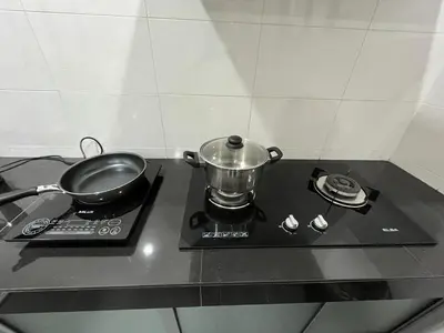 a pot sitting on top of a stove at Green Woody Homestay in Ipoh
