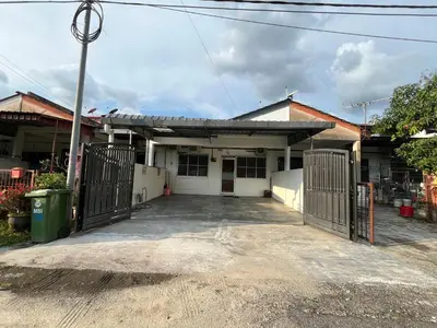 a house with a gate in front of it at Green Woody Homestay in Ipoh