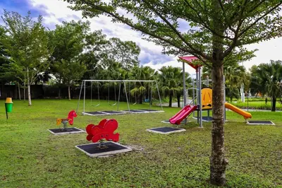 a park with a playground with slides and swings at Residensi Meru Raya in Ipoh
