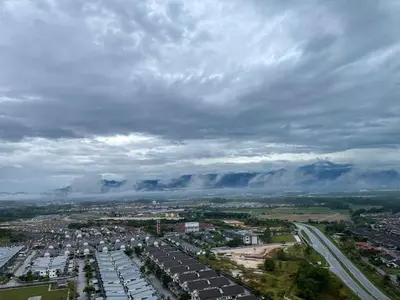 an aerial view of a city with a cloudy sky at Residensi Meru Raya in Ipoh