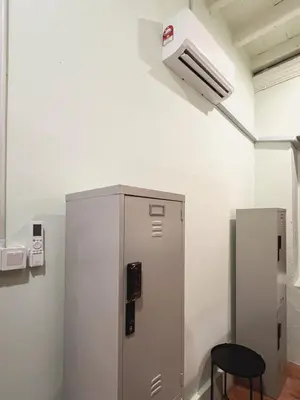 a metal machine in a room with a fan at Pine Muntri in George Town