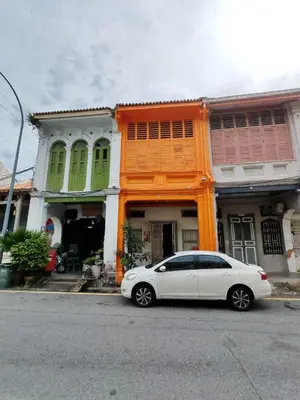 a white car parked in front of a house at Pine Muntri in George Town