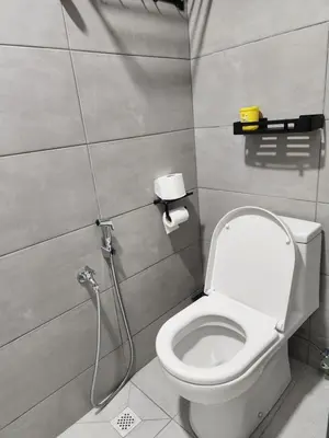 a bathroom with a toilet and a shower at CATAILIS Metropol Serviced Apartment Bandar Perda Bukit Mertajam near Penang Bridge in Bukit Mertajam