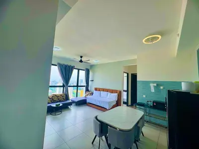a living room with a couch and a table at cozy 3BR family suites 10pax in Jelutong