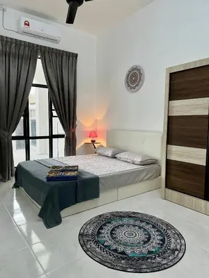 a bedroom with a bed and a large window at Pitaloka The Lakes Homestay in Batu Gajah