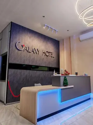 a lobby of a galaxy hotel with a sign on the wall at Galaxy Hotel Bandar Perda in Bukit Mertajam