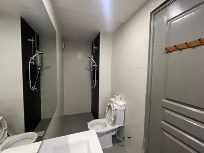 a bathroom with a toilet and a shower stall at DanteQuintet Cameron Highlands in Tanah Rata