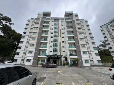 a large apartment building with cars parked in front of it at DanteQuintet Cameron Highlands in Tanah Rata
