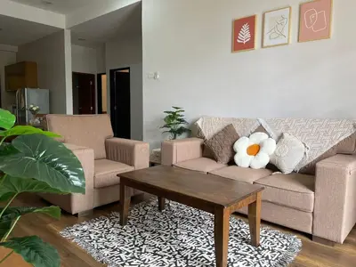 a living room with a couch and a coffee table at GreenValley in Brinchang