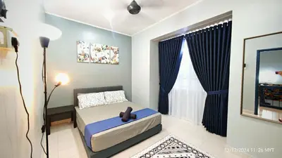 a bedroom with a bed and a large window at Homestay Santai Bertam in Kepala Batas