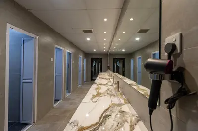 a long hallway with a camera in a building at Resthub in George Town