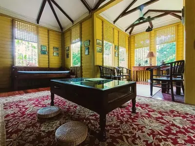 a room with a pool table in the middle of a room at Bagas Zakariah Orchard Lodge in Gopeng