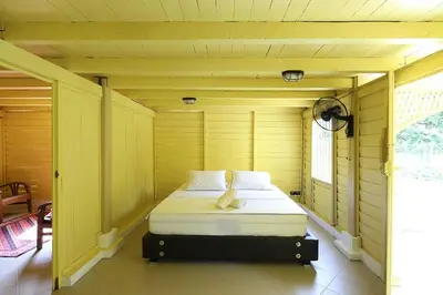 a room with a bed in a small room at Bagas Zakariah Orchard Lodge in Gopeng