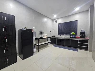 a kitchen with a black refrigerator and a counter at V-Home Taiping, 3BR, 7pax, Full Aircond, Wifi & Netflix, Early Bird Promo in Taiping