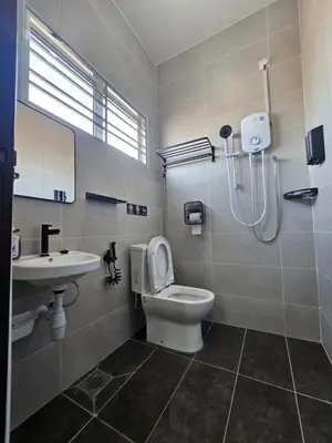 a bathroom with a shower and a toilet and a sink at V-Home Taiping, 3BR, 7pax, Full Aircond, Wifi & Netflix, Early Bird Promo in Taiping