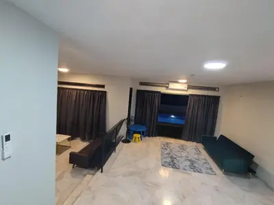 a living room with two couches and a couch at Homestay 39 Private Pool Perak in Tanjung Rambutan