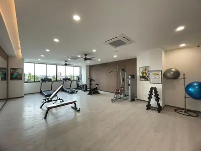a gym with exercise equipment in a large room at Jovial MarcResidence ````BmSongBanKheng in Bukit Mertajam