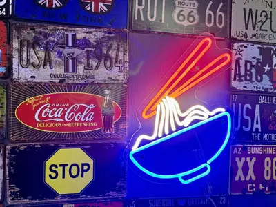 a bunch of neon signs on a wall at Moon22 Private Pool in Ipoh