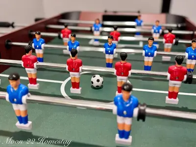 a group of toy figurines playing a soccer game at Moon22 Private Pool in Ipoh