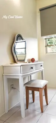a white dressing table with a mirror and a stool at Natural Garden Stay in Cameron Highlands in Tanah Rata