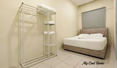 a small bedroom with a bed and a shower at Natural Garden Stay in Cameron Highlands in Tanah Rata