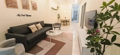 a living room with a couch and a table at Natural Garden Stay in Cameron Highlands in Tanah Rata
