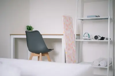 a black chair sitting in front of a desk at NEW The Sun 3Bedrooms 10pax 2CP in Bayan Lepas