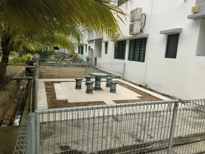 a patio with a table and three trash cans at Pangkor Shu Yuan \u90a6\u54af\u5c9b\u5885\u82d1\u6d77\u6ee9\u522b\u5885 in Pangkor