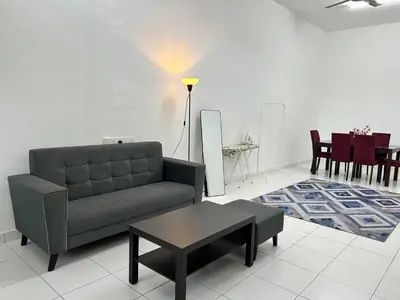 a living room with a couch and a table at ZN LODGE at KAMUNTING in Kamunting