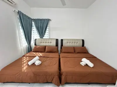 a bed in a room with two pillows on it at ZN LODGE at KAMUNTING in Kamunting