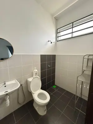 a bathroom with a toilet and a sink at ZN LODGE at KAMUNTING in Kamunting