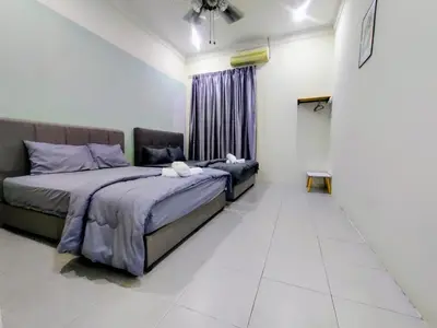 a bedroom with two beds and a window at 13paxs Semi D Homestay Hutan Melintang in Hutan Melintang