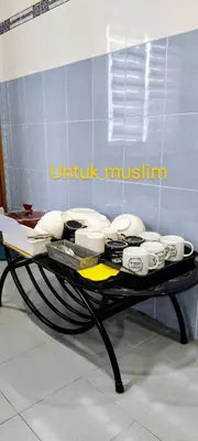 a table with a bunch of appliances on it at 13paxs Semi D Homestay Hutan Melintang in Hutan Melintang