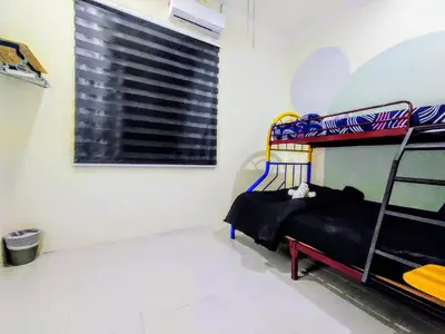 a bedroom with a bunk bed and a window at 13paxs Semi D Homestay Hutan Melintang in Hutan Melintang