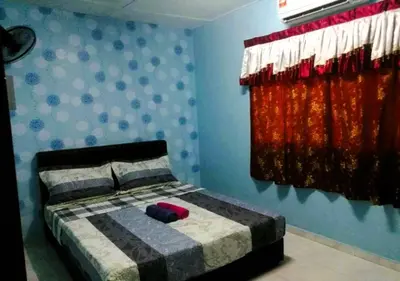 a bedroom with a bed with blue walls and red curtains at NO DEPOSIT - BIG Home 2-sty Terrace Near World Theme Park Hot Springs & Night Park max 6person in Ipoh