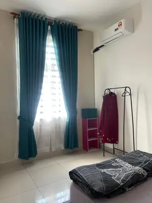 a bedroom with a bed and a window with blue curtains at Homestay Sakura in Padang Serai